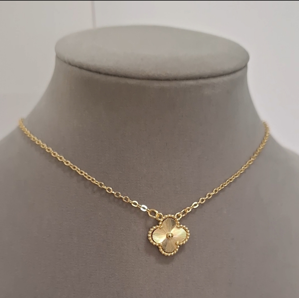 Double sided gold-filled single clover necklace.